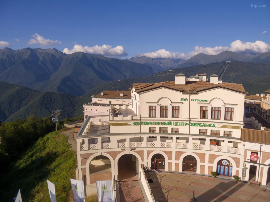 Completed hotel exterior with mountain views